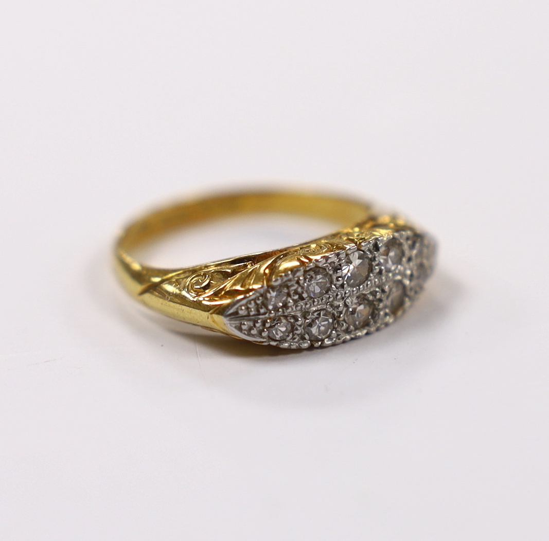 An 18ct, plat. and ten stone diamond set two row ring, size L, gross weight 4.9 grams.